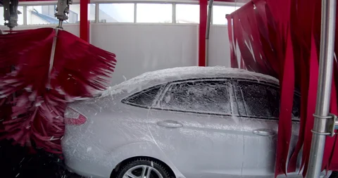 Can I take my Tesla to a car wash with brushes